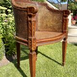 Fauteuil en bois fruitier et cannage style Louis XVl