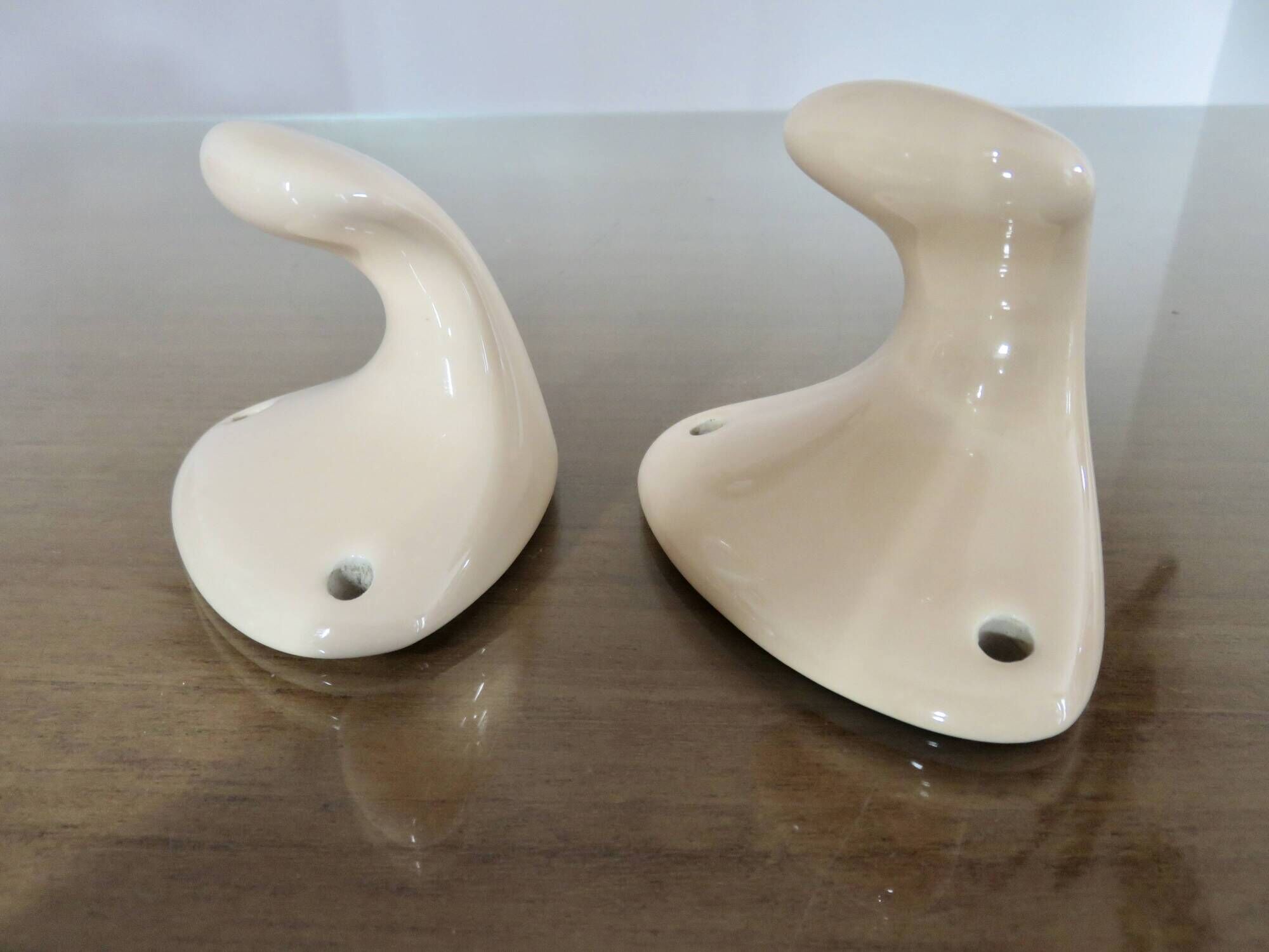 Pair of salmon-colored art deco porcelain hooks from the 30s and 40s