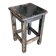 Solid wood stool with a worn black patina.