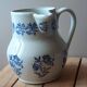 Large antique cruet in Saint Uze earthenware with blue flowers.