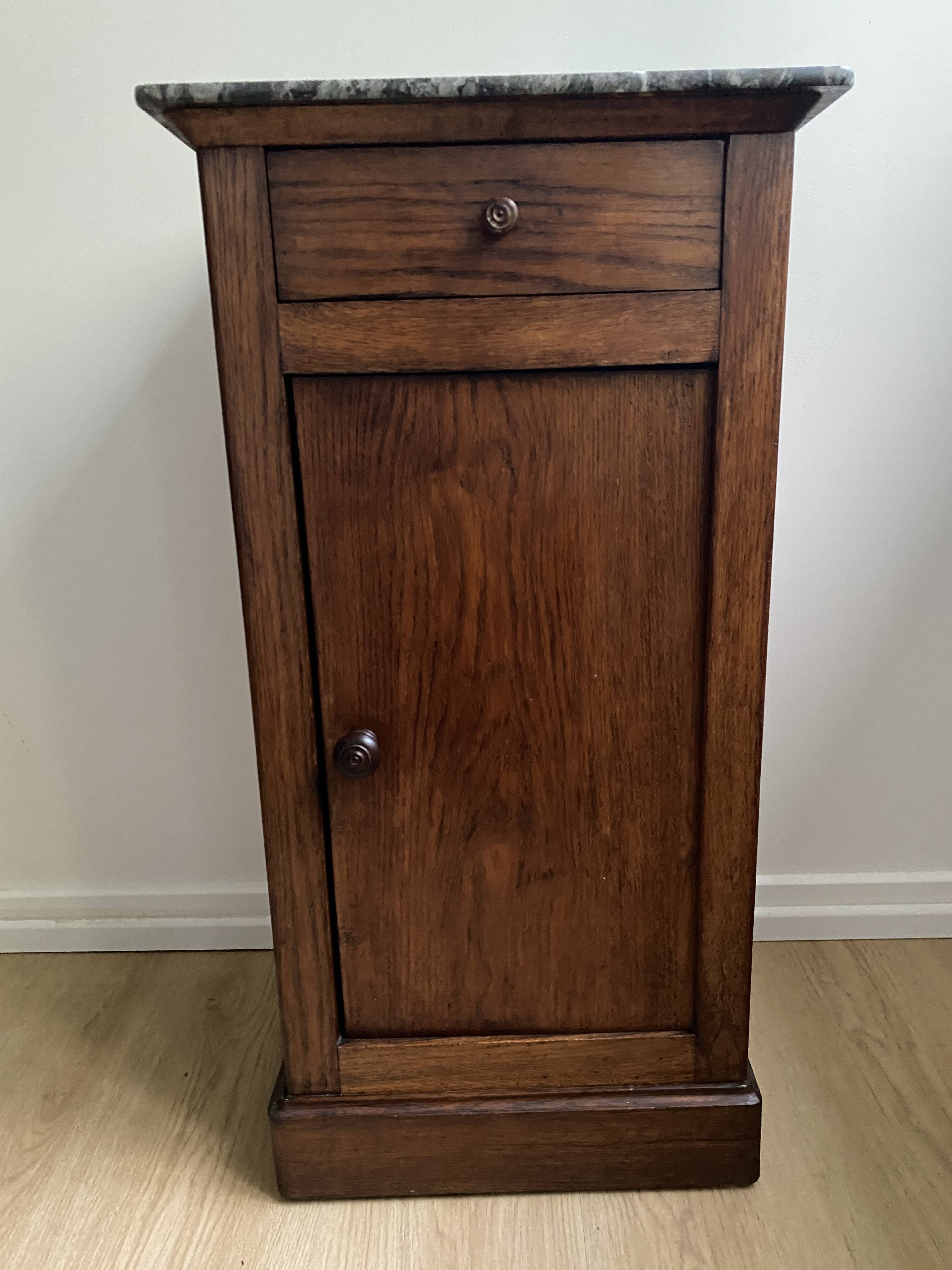 Vintage bedside table in the shape of a wooden column and a gray marble top