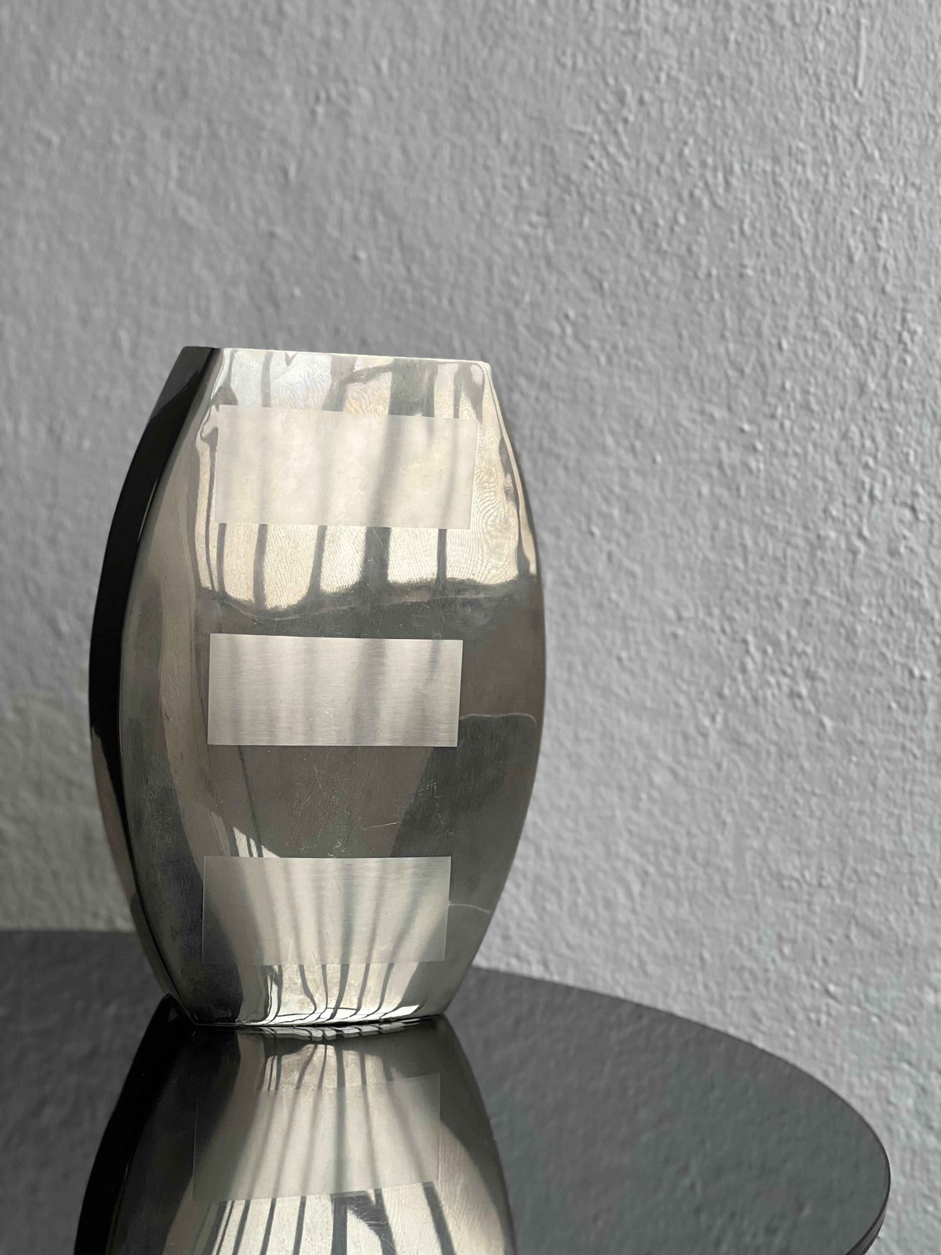 Decorative stainless steel vase with geometrical shapes imprinted, 1970's