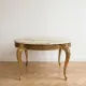 Baroque style coffee table with marble and gilded wood.