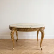 Baroque style coffee table with marble and gilded wood.