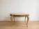 Baroque style coffee table with marble and gilded wood.