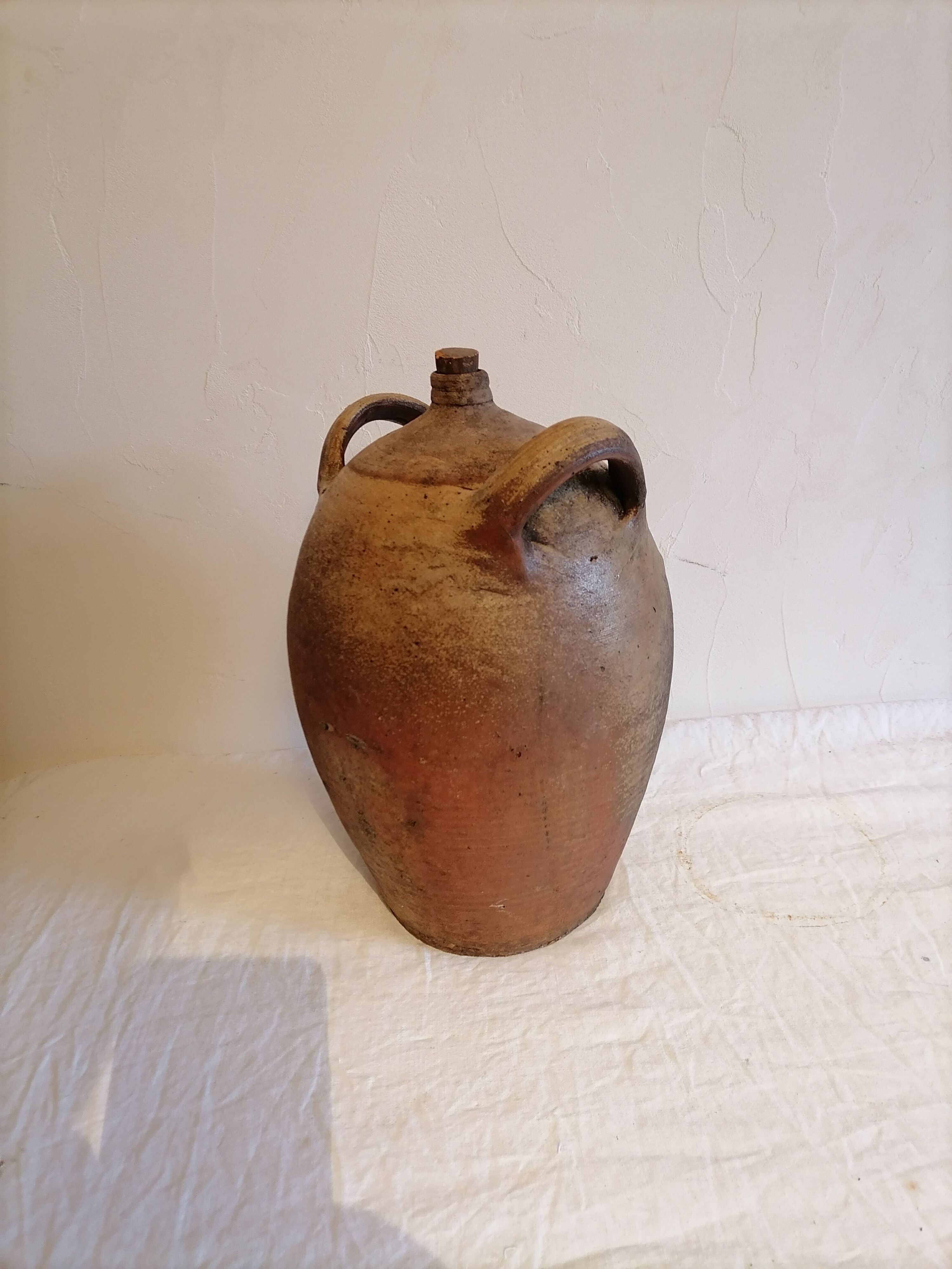Old jar, glazed sandstone jug. Early twentieth century.