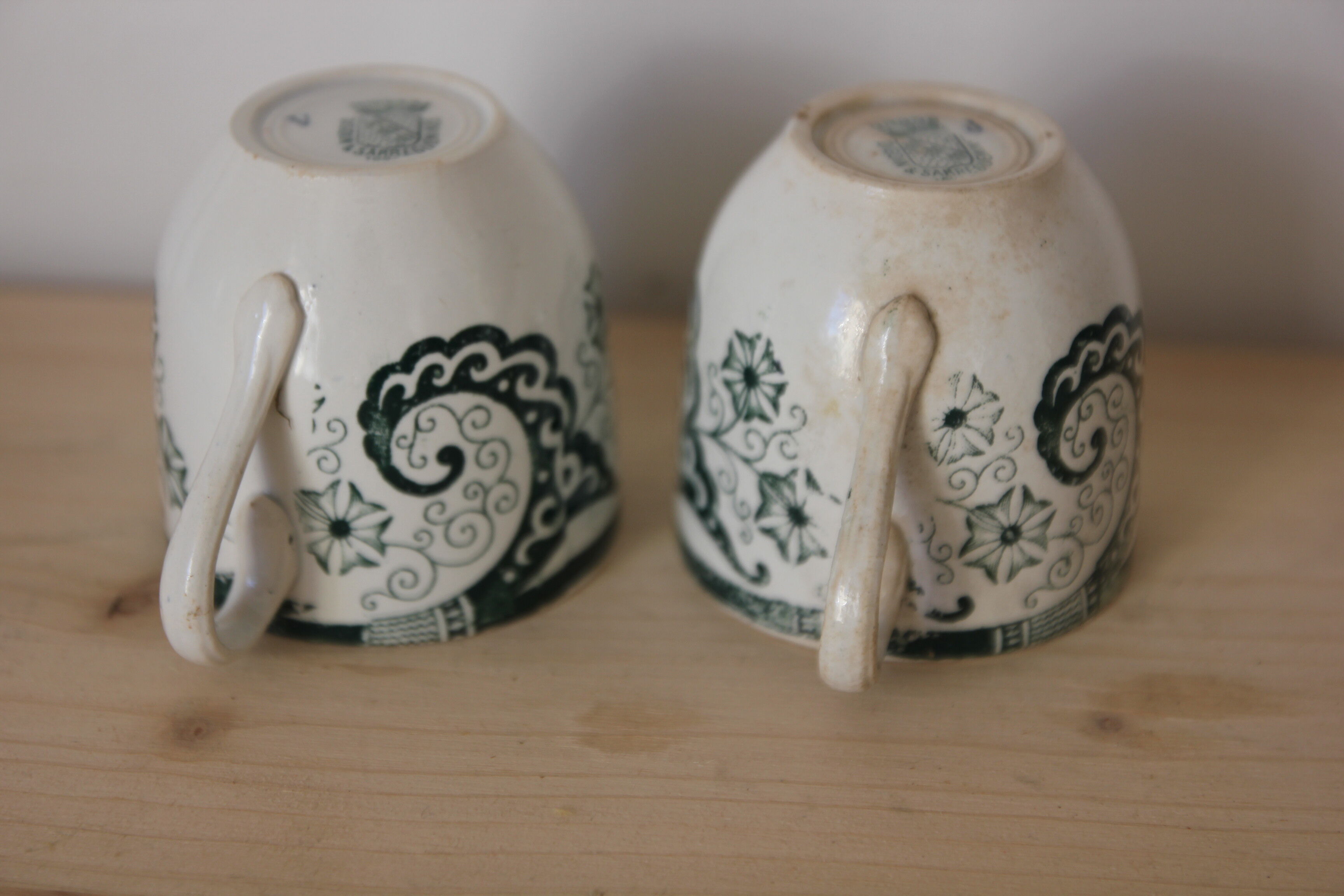 Pair of iron earth cups