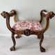 Neo-Renaissance banquette style with lion heads
