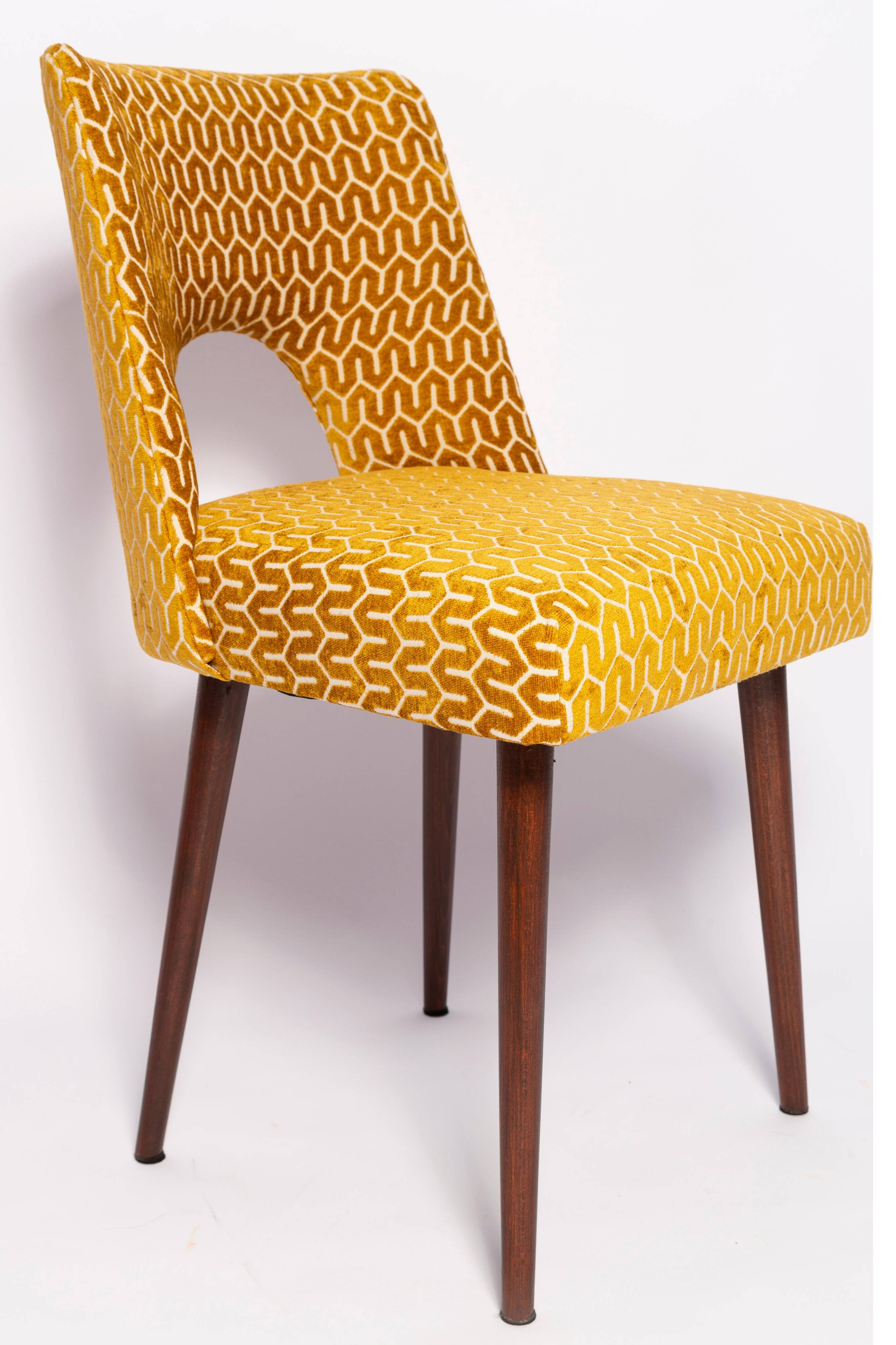 Mustard yellow shell chair, mid-century style, Europe, 1960s.