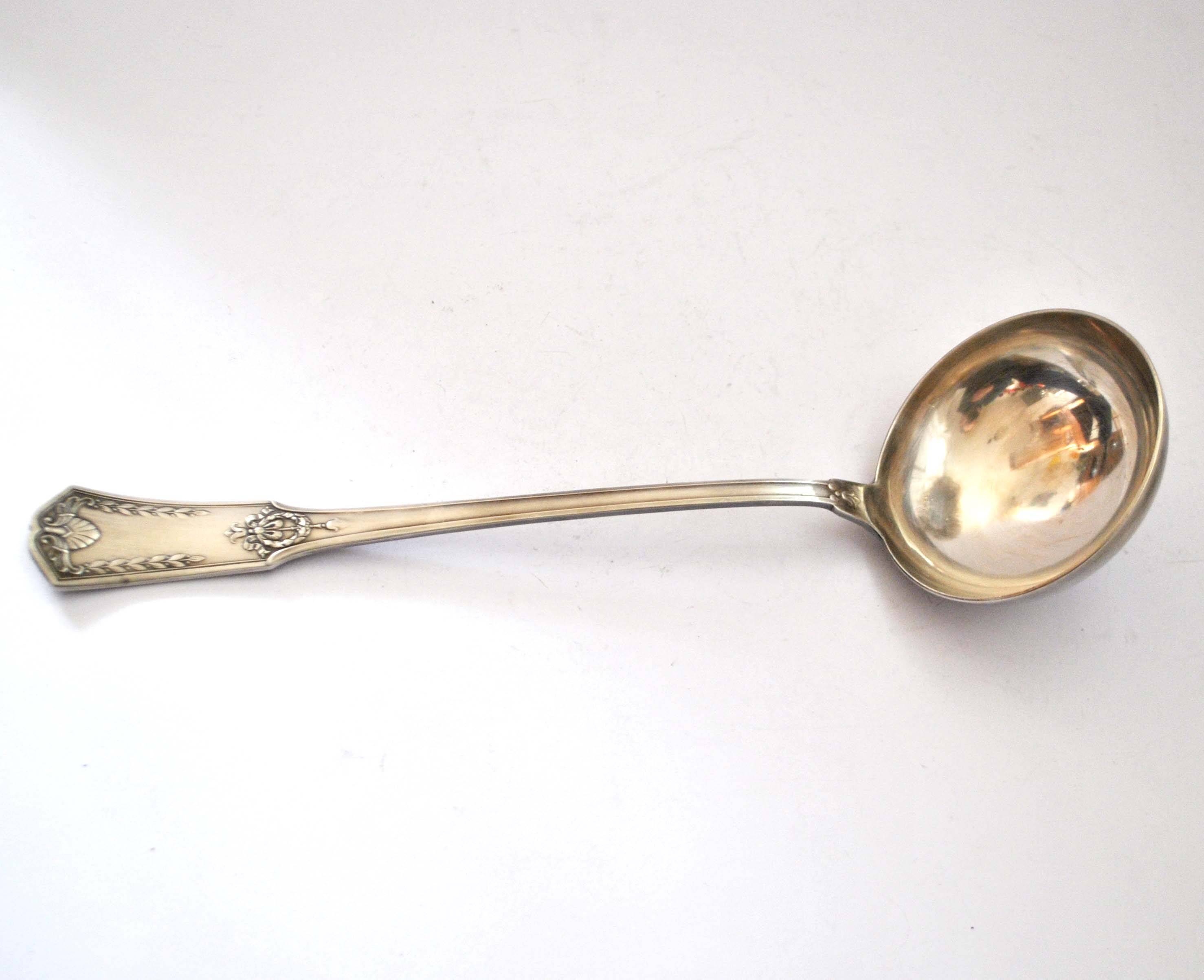 Empire ladle in silver metal SFAM - "Sans embarrass" model with winged shell laurel crown