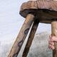 Carved wooden tripod stool