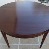 Round mahogany table with mahogany veneer and brass sabot foot.