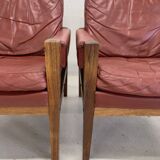 Fauteuils lounge danois vintage en palissandre et cuir. Années 1960.