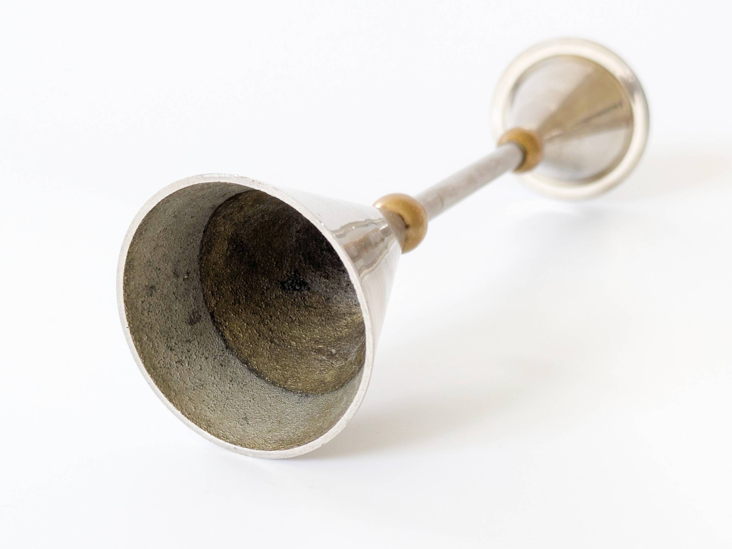 Pair of postmodern candlesticks in Memphis style made of steel and brass.