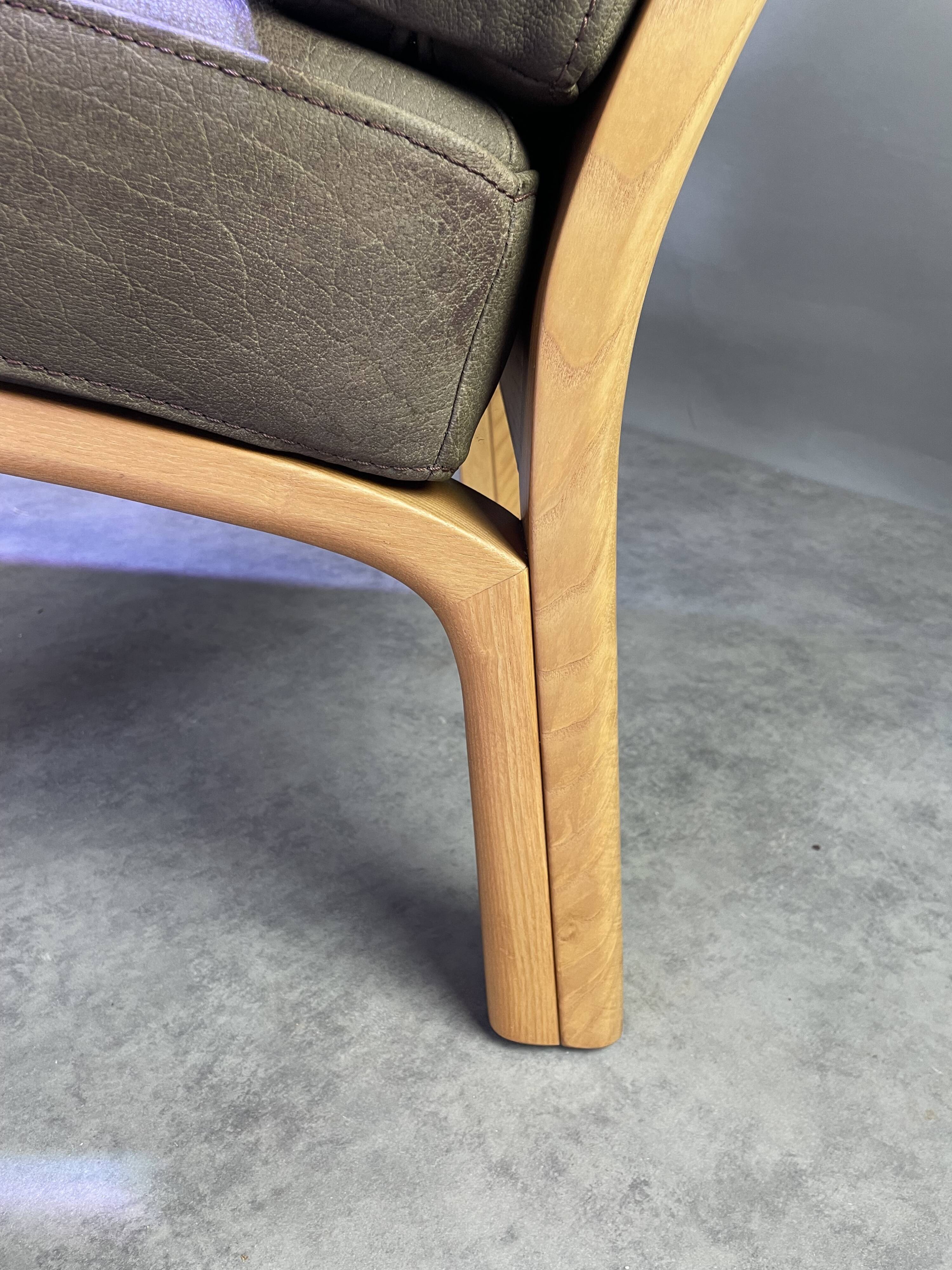 Chocolate leather armchair, wooden structure