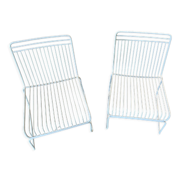 Many handcrafted wrought iron chairs