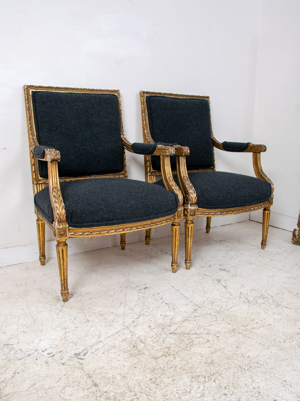 Pair of 19th century Louis XVI gilt armchairs newly re upholstered in holland and sherry fabric