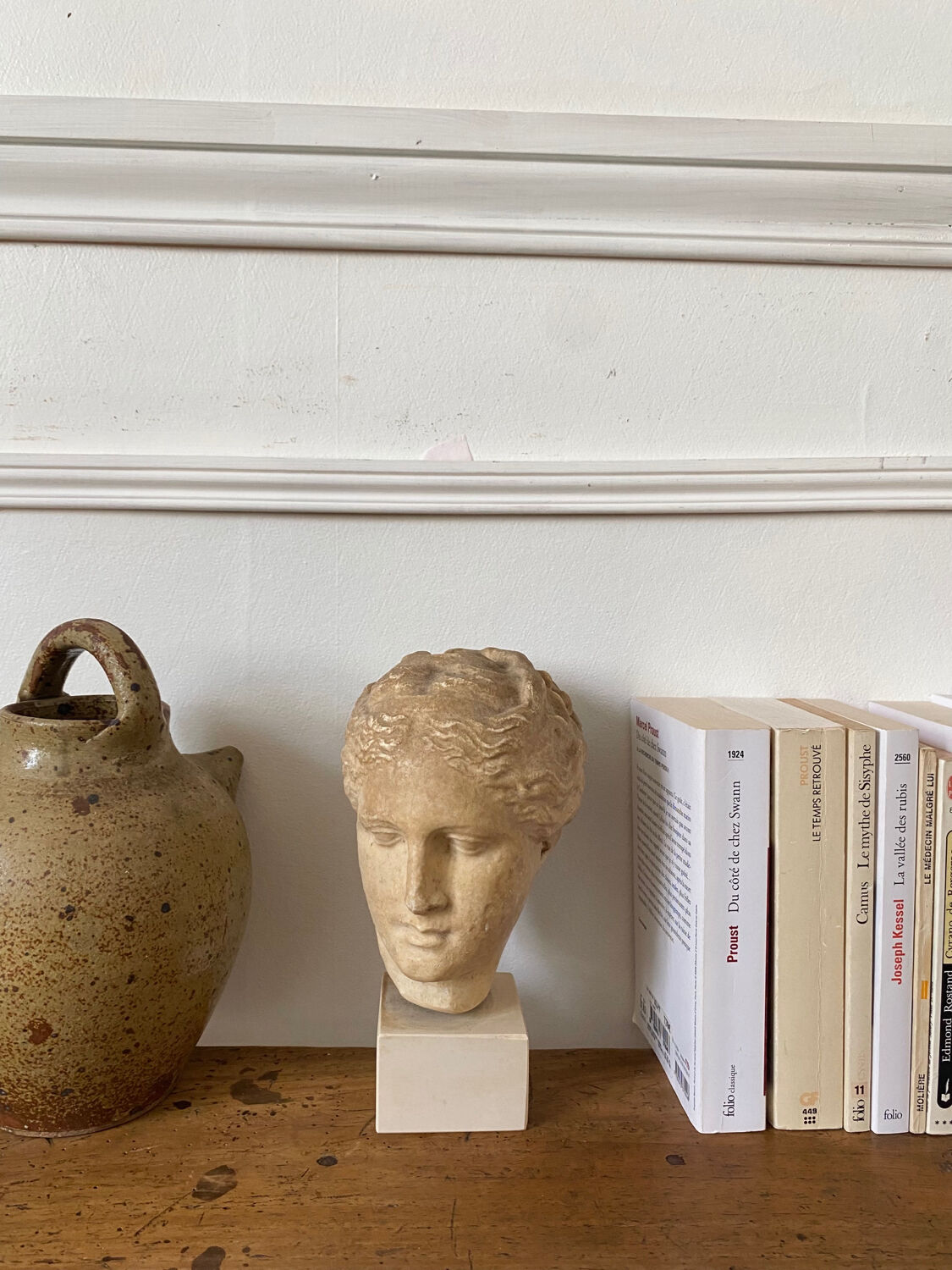 Head of a greek goddess in stone