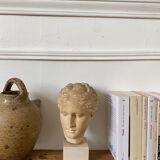 Head of a greek goddess in stone