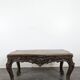 Louis XV coffee table in carved walnut with a gilded leather top.