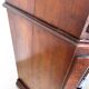 A pair of antique walnut bedside tables from the 1890s.