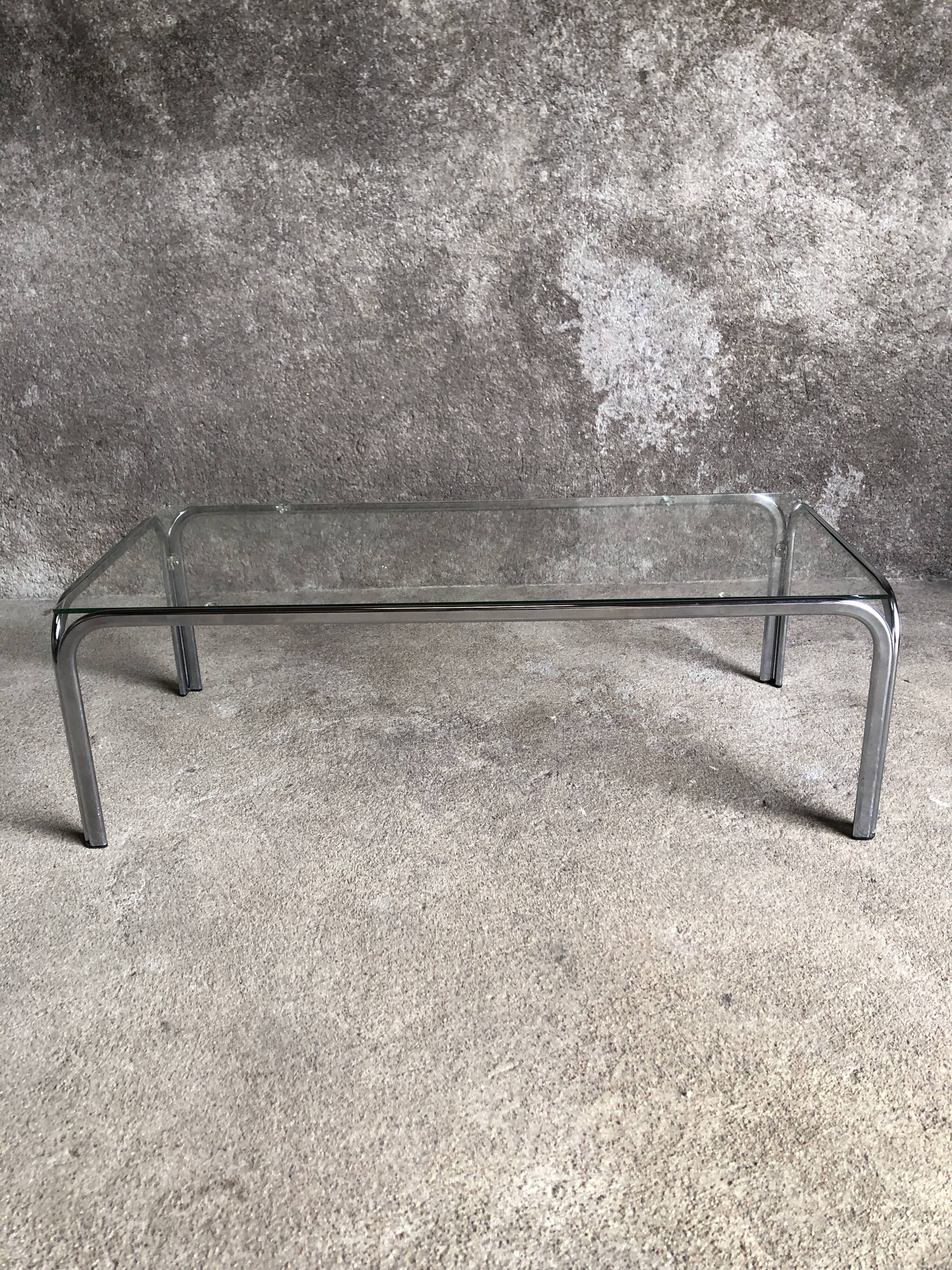 Coffee table with chrome legs and glass top, 1970