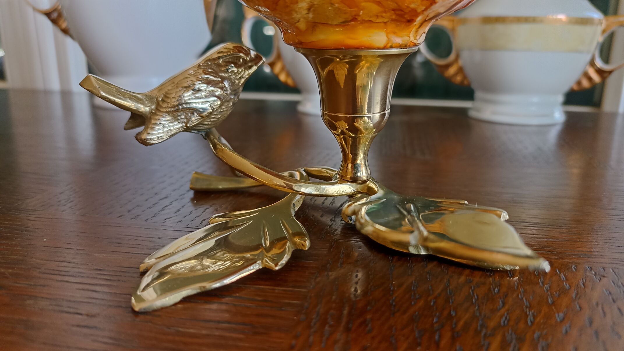 Brass cup in the shape of a bird and flowers