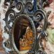Antique Louis XV style mirror, richly carved with decorations of scrolls, shells, and foliage.