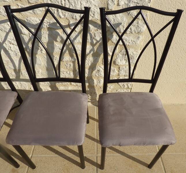 4 black metal chairs with high backs and gray suede tops
