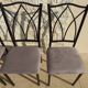 4 black metal chairs with high backs and gray suede tops