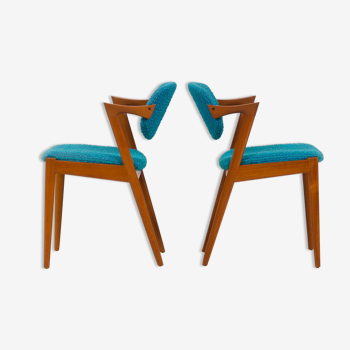 Pair of 42 Kai Kristiansen teak chairs in original blue bouclé upholstery, Denmark, 60s.