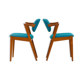 Pair of 42 Kai Kristiansen teak chairs in original blue bouclé upholstery, Denmark, 60s.