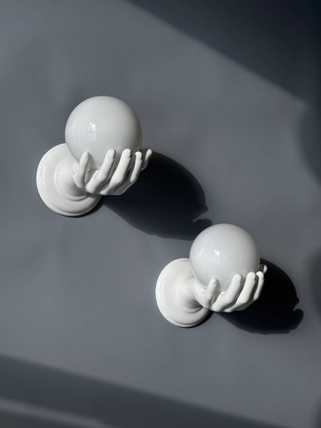 Pair of opaline and ceramic hand sconces