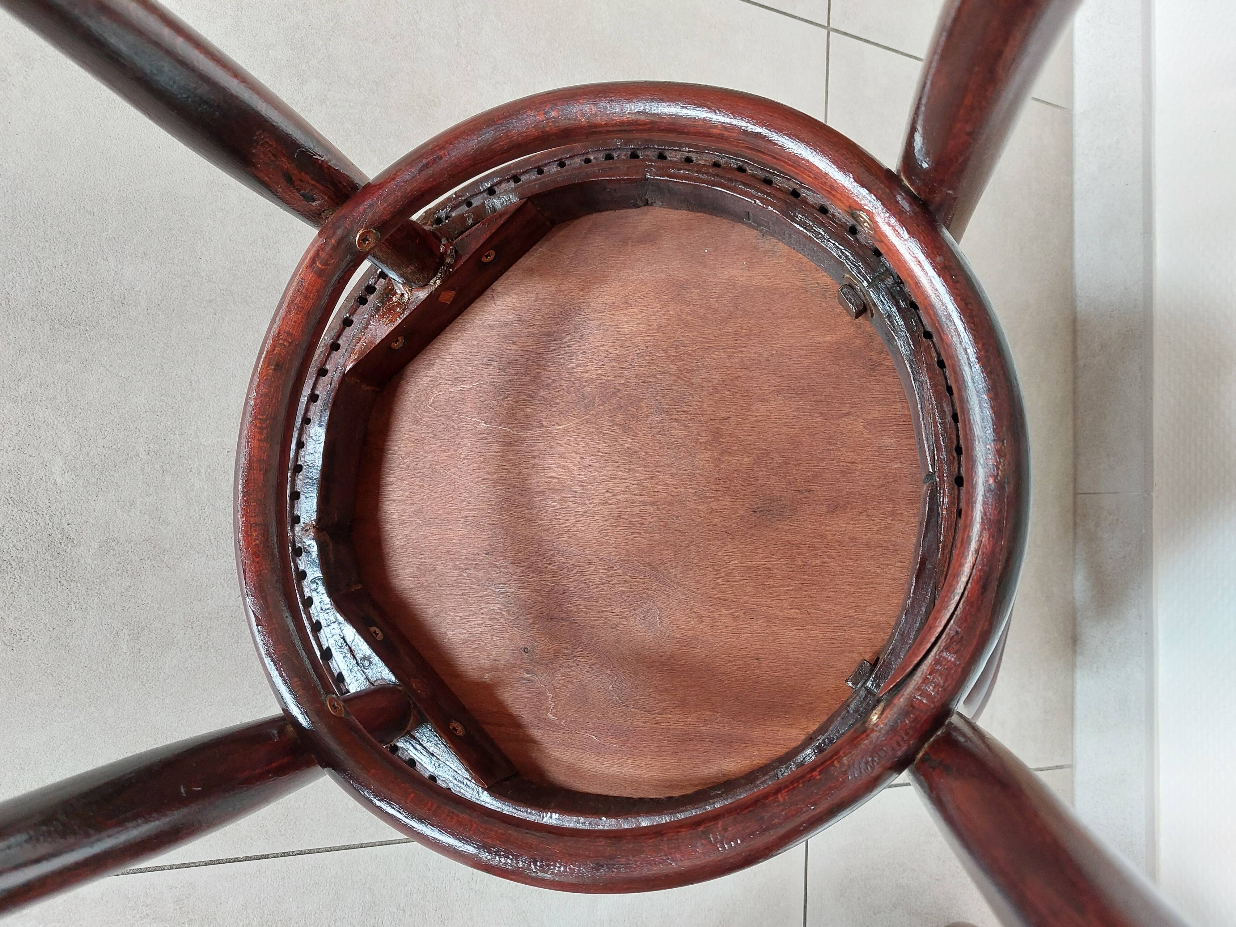 pair of round bistro chairs with a pattern on the seat, vintage