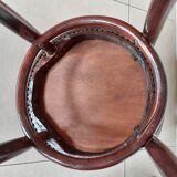 pair of round bistro chairs with a pattern on the seat, vintage