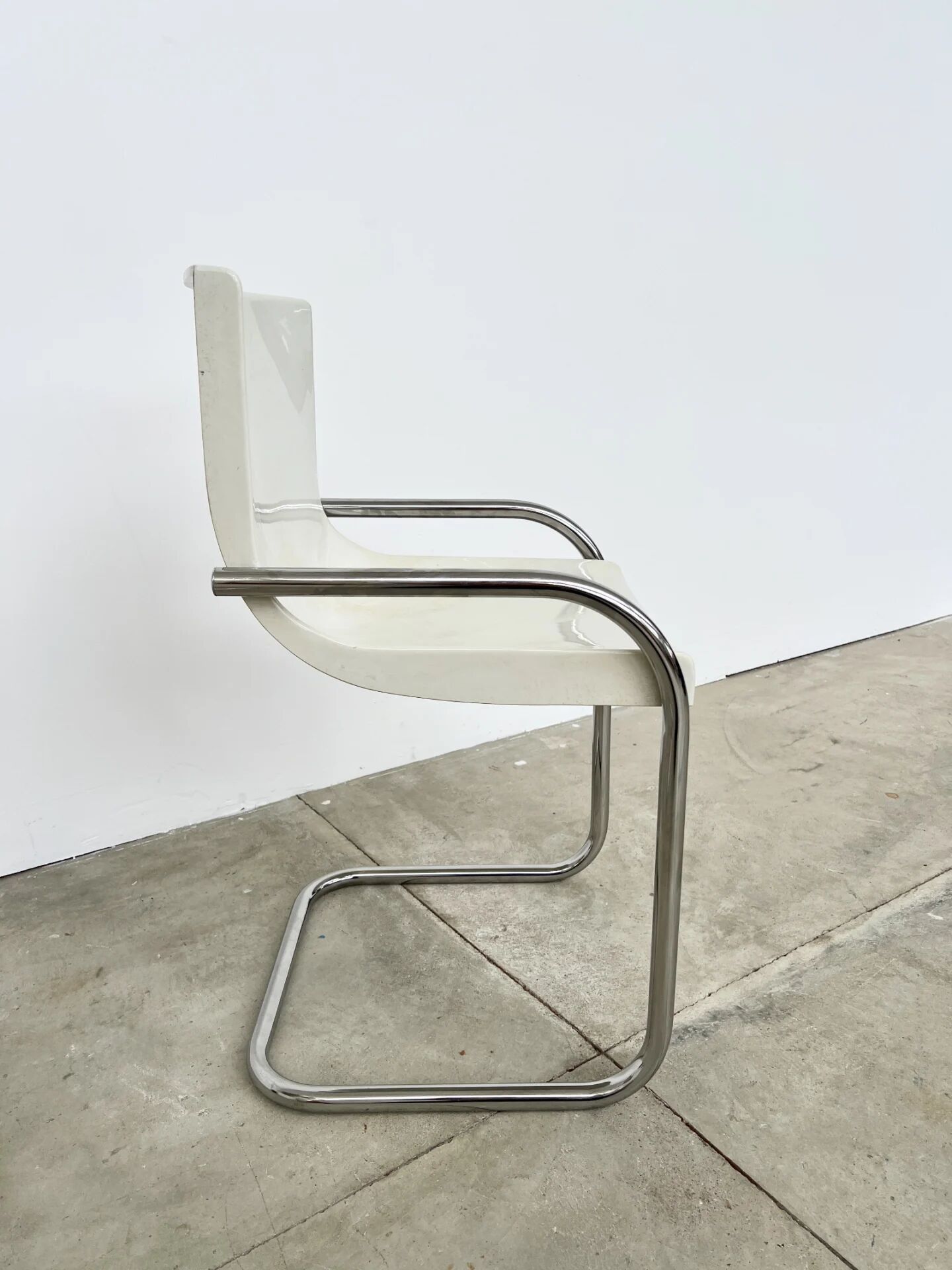Pair of white moulded shell chairs with chrome tube — Space Age 70s