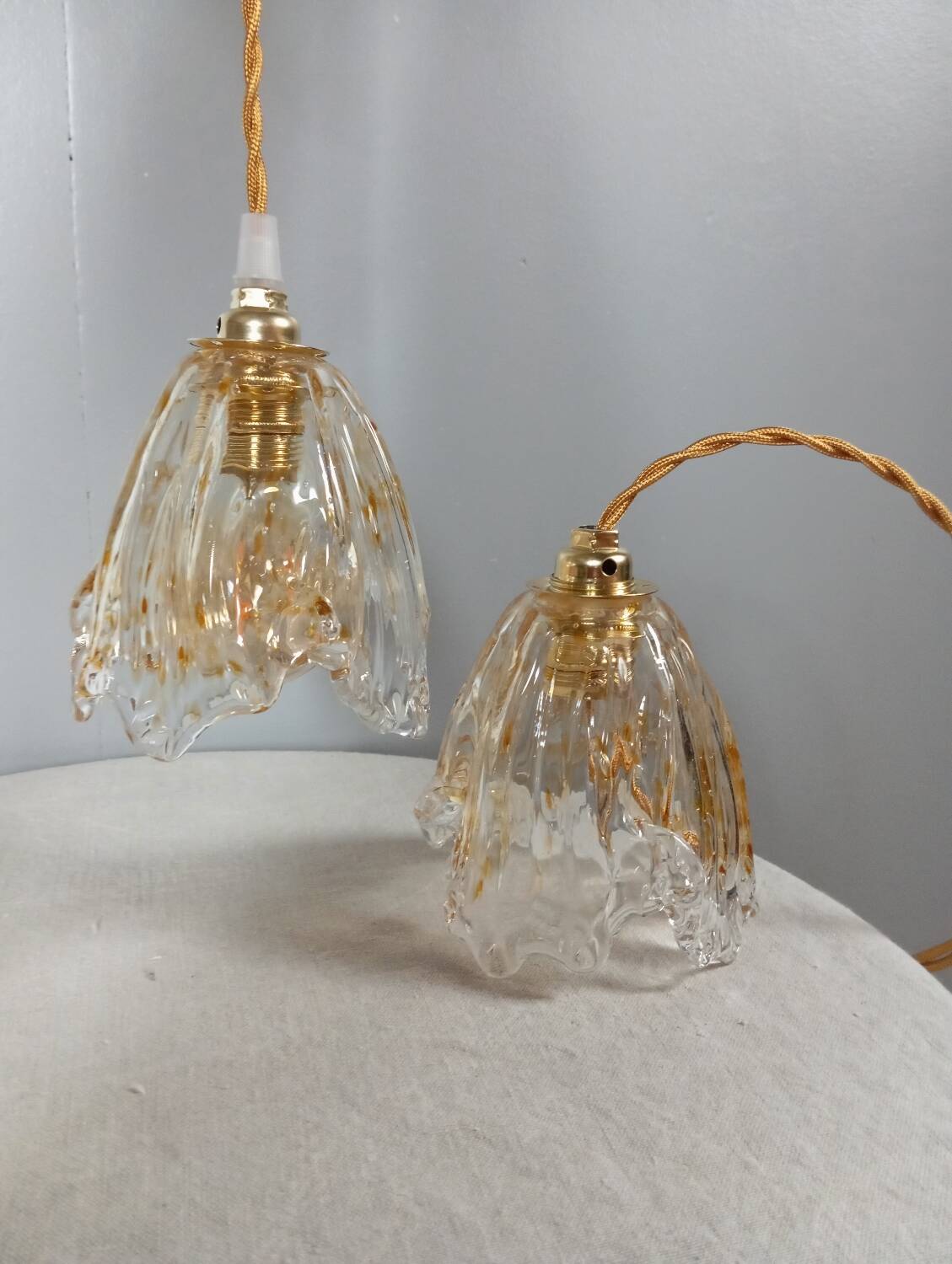 Pair of draped blown glass hanging lamps, ocher twisted wire