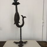 Old and patinated metal candlestick