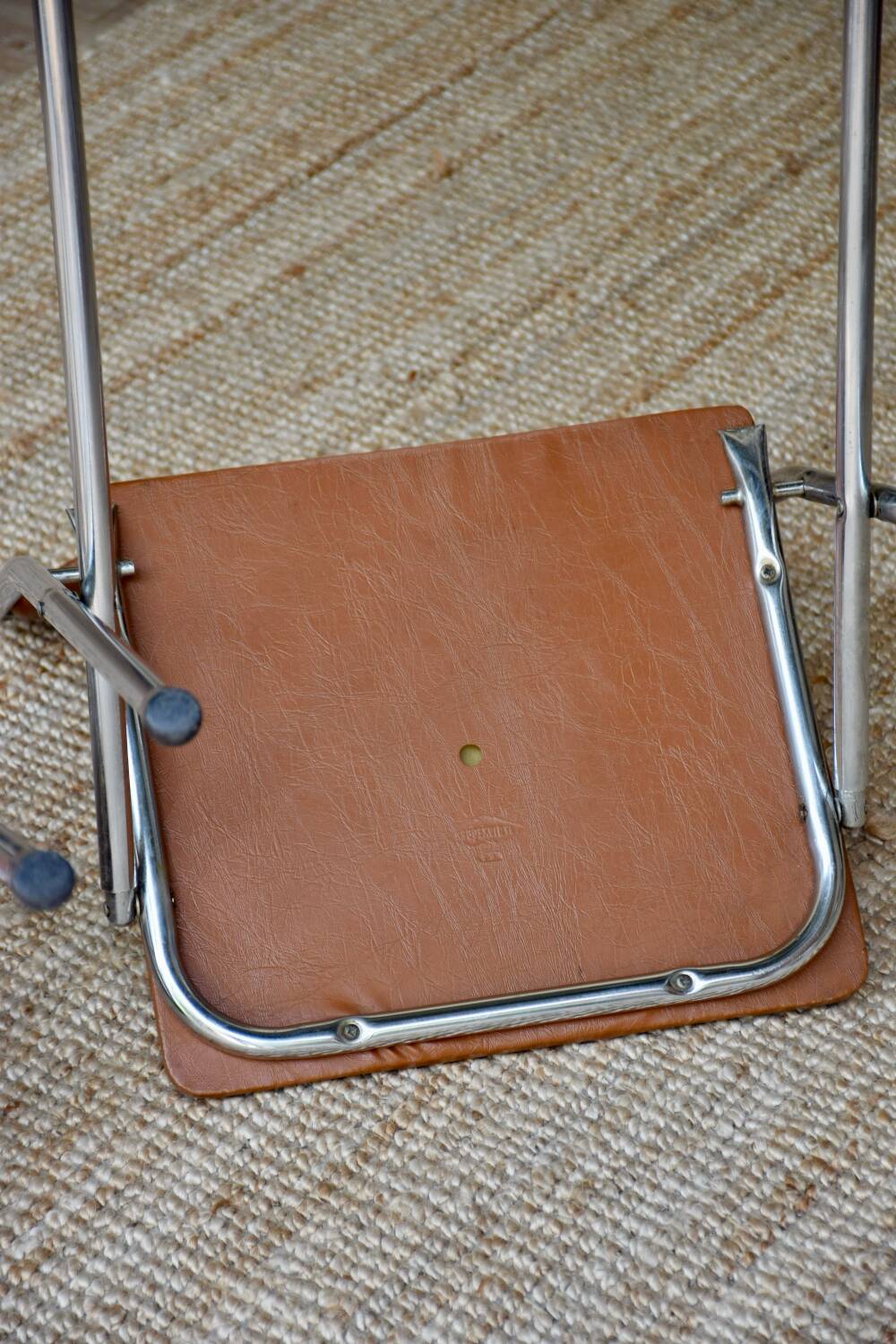 Pair of “Soudexvinyl” folding chairs in skai and chrome tube