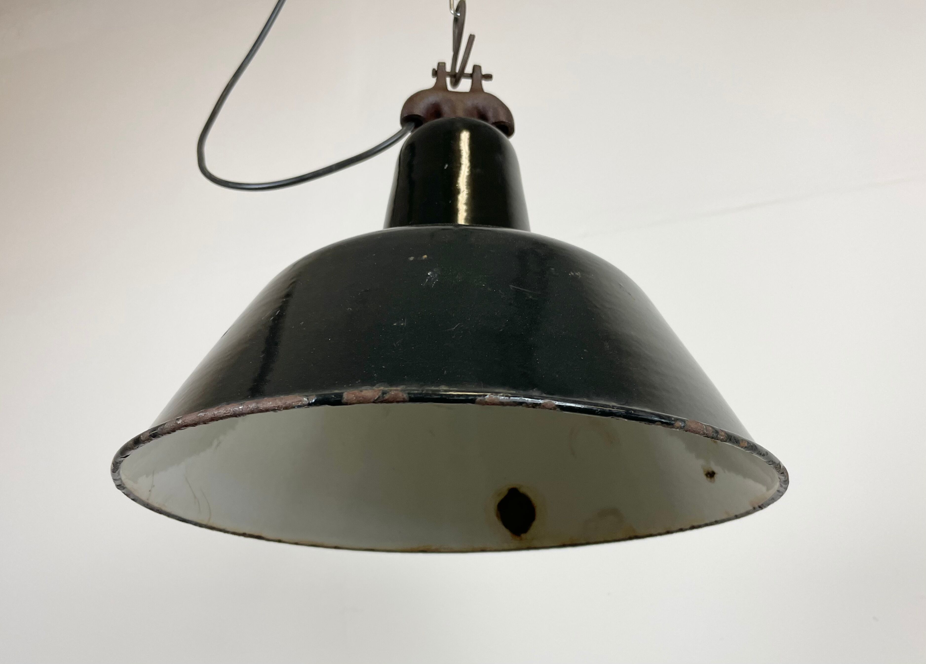 Industrial black enamel factory lamp with cast iron top, 1950s