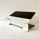 Black and cream metal magazine rack, 1950s.