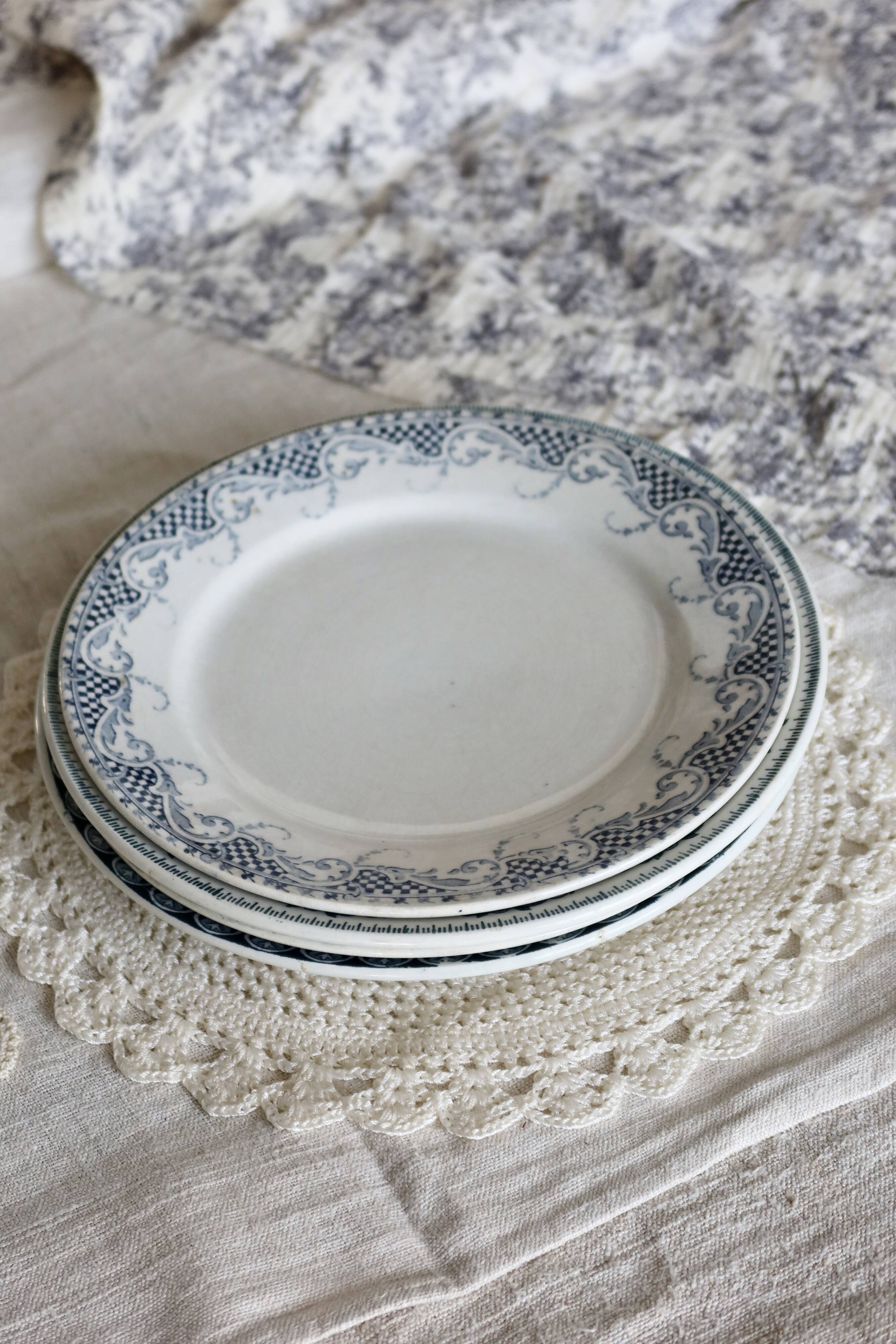 Mismatched vintage flat plates in green and blue ironstone.