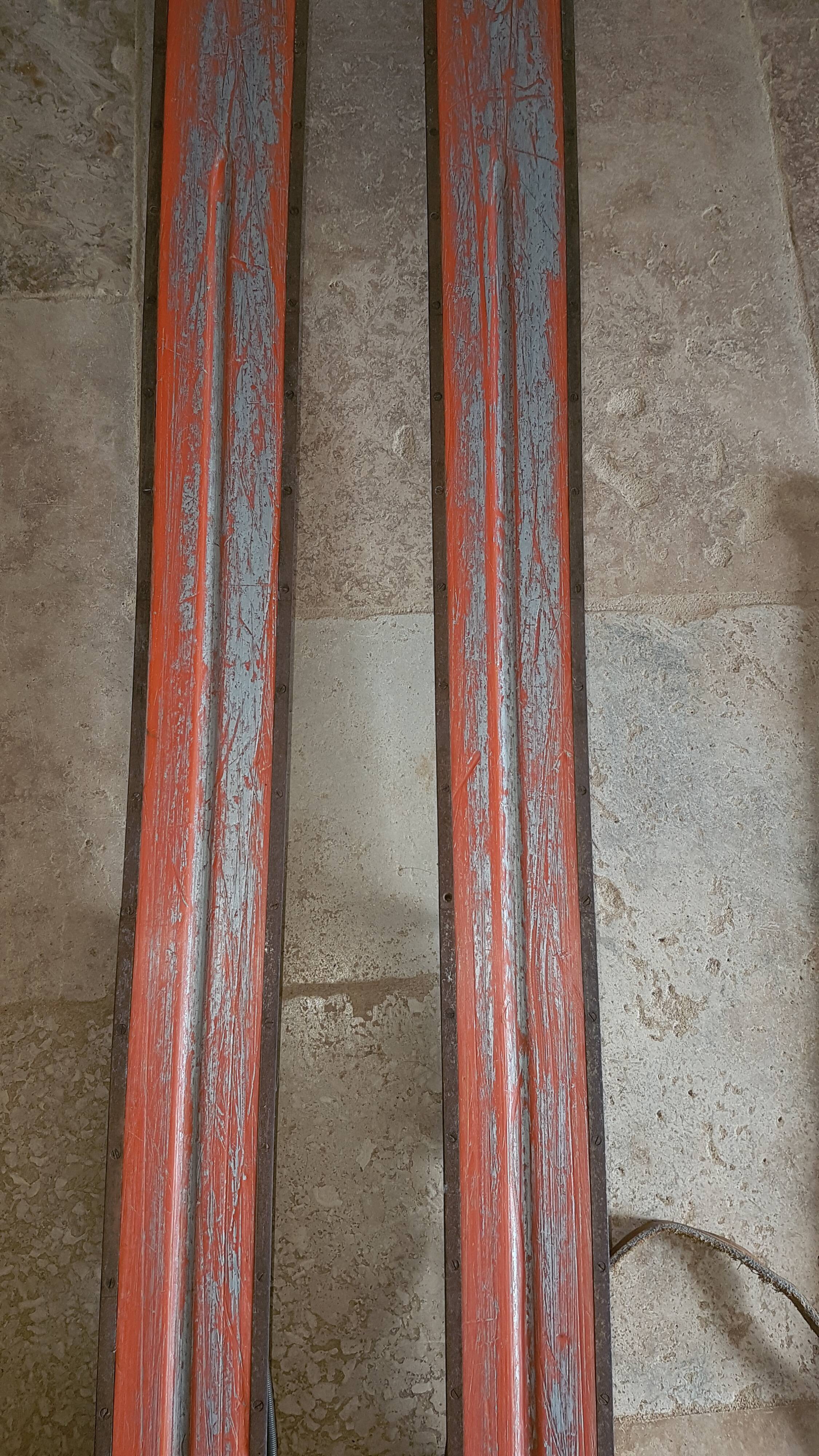 Old skis wooden and its pair of sticks
