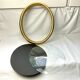 Old oval gilded wooden frame with domed glass