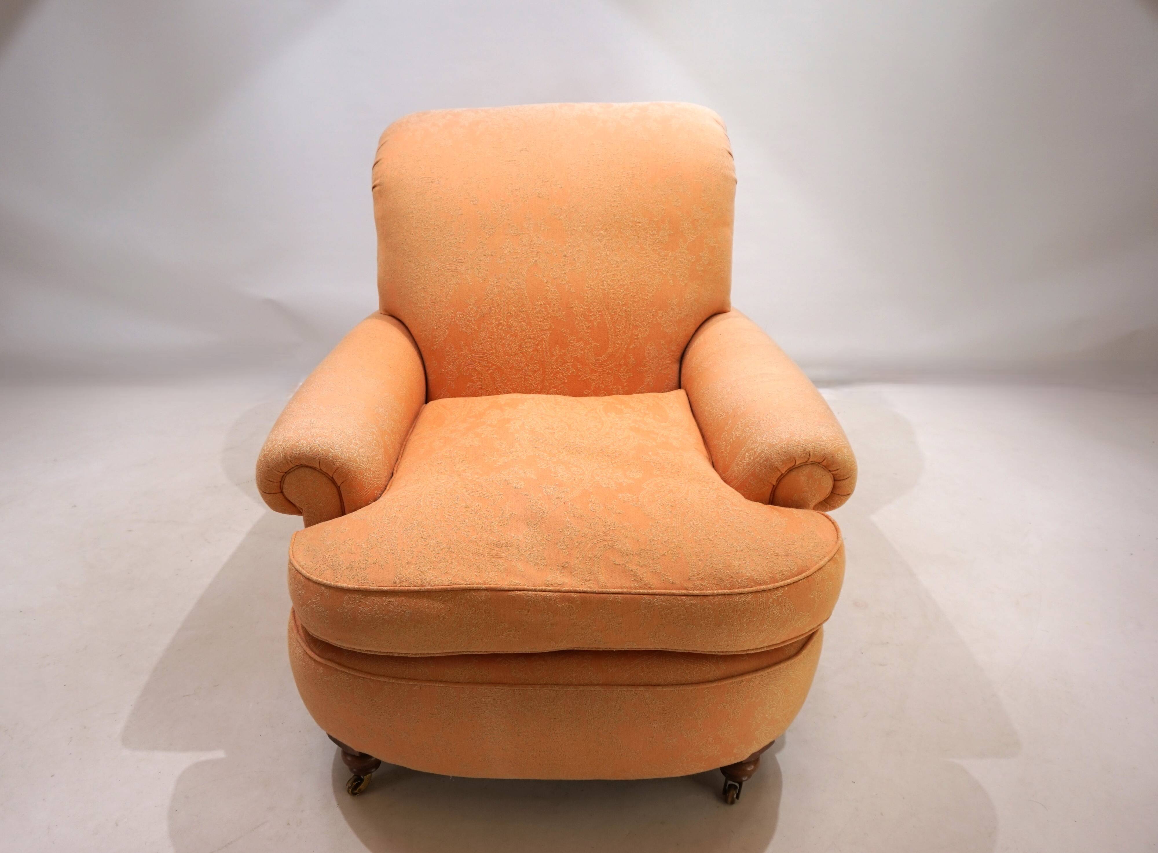 Deep seated armchair in the style of Howard & Sons