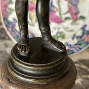 Narcissus, bronze after the antique on a wooden base, circa 1880.