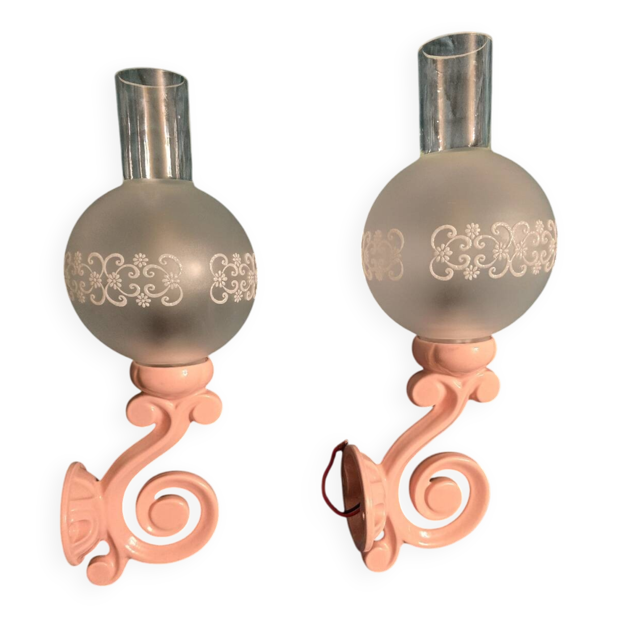 Original wall lights in pink enamelled cast iron with frosted glass globes.