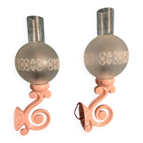Original wall lights in pink enamelled cast iron with frosted glass globes.