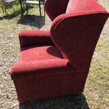 Impressive red velvet eared armchair