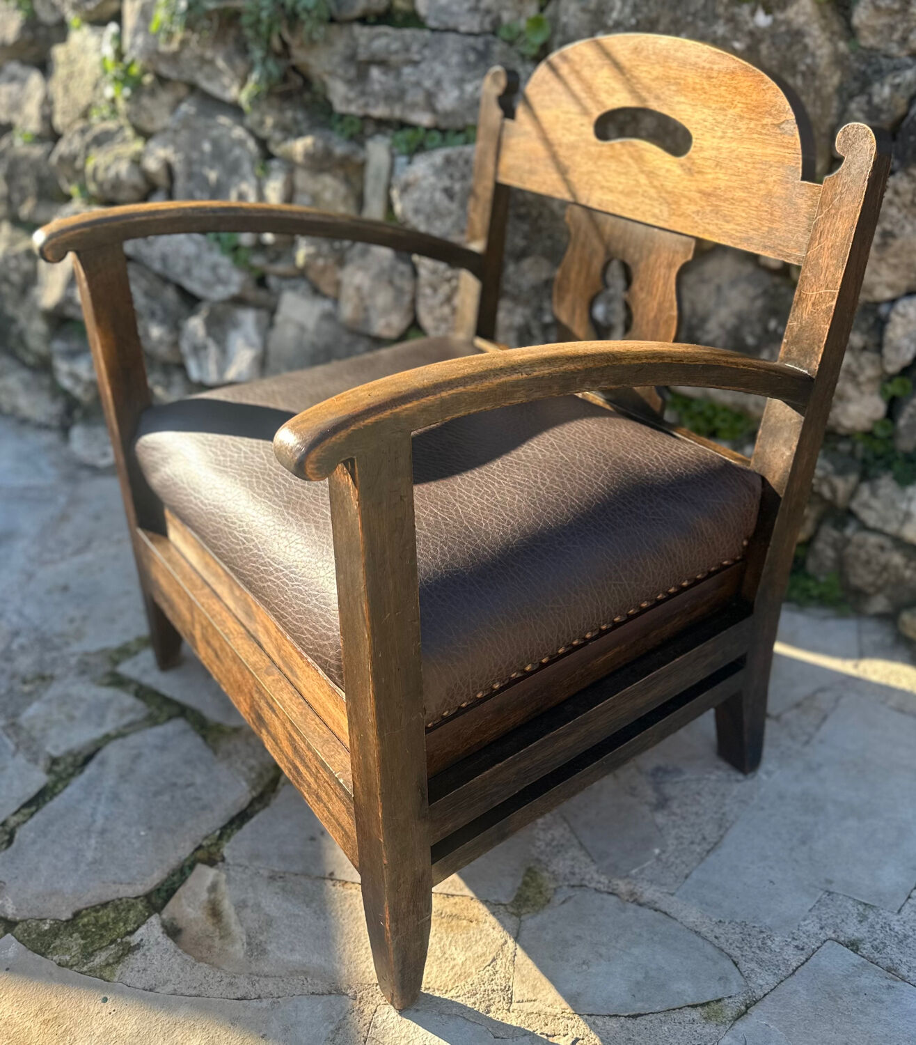 Pair of armchairs in stained wood and leather, 20th century